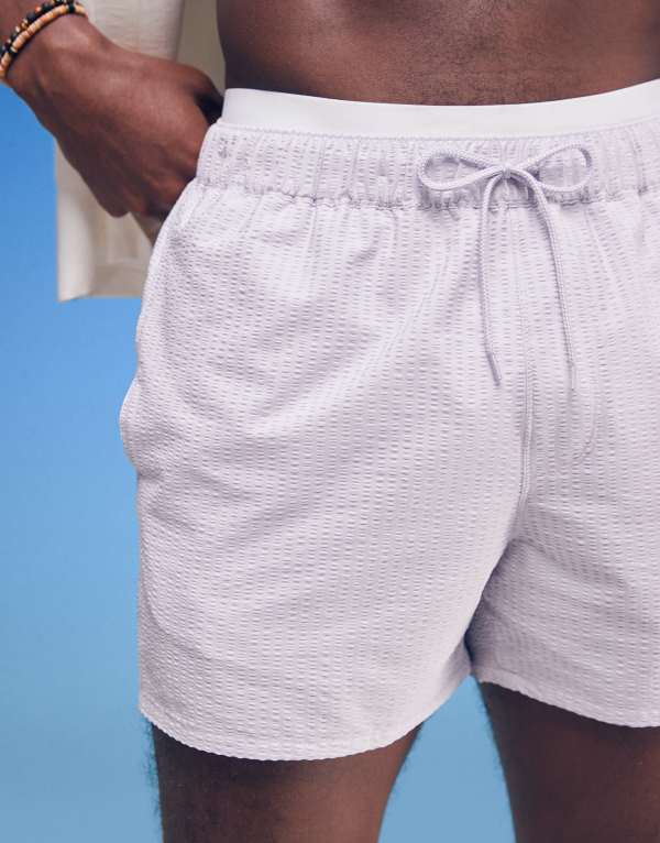 【送料無料】 エイソス メンズ ハーフパンツ・ショーツ 水着 ASOS DESIGN seersucker swim shorts in short length in purple PURPLE