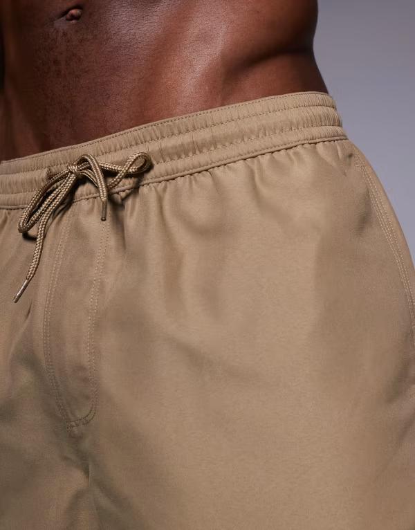 【送料無料】 エイソス メンズ ハーフパンツ・ショーツ 水着 ASOS DESIGN swim shorts in mid length in dark stone Dark stone