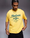 【送料無料】 エイソス メンズ Tシャツ トップス ASOS DESIGN boxy oversized t-shirt with city graphic in yellow Solar power