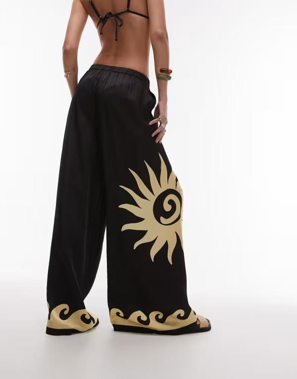 【送料無料】 ウィ ウォー ワット レディース カジュアルパンツ ボトムス WeWoreWhat sun wave placement wide leg beach pants in black Black/Off-White