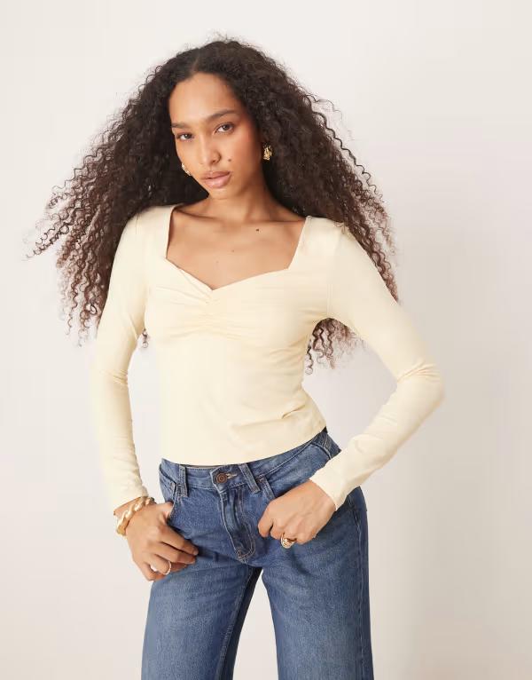 エイソス レディース トップス Tシャツ ギャザー ASOS DESIGN polyamide slinky long sleeve top with ruched bust in pastel yellow Pastel Yellow イエロー