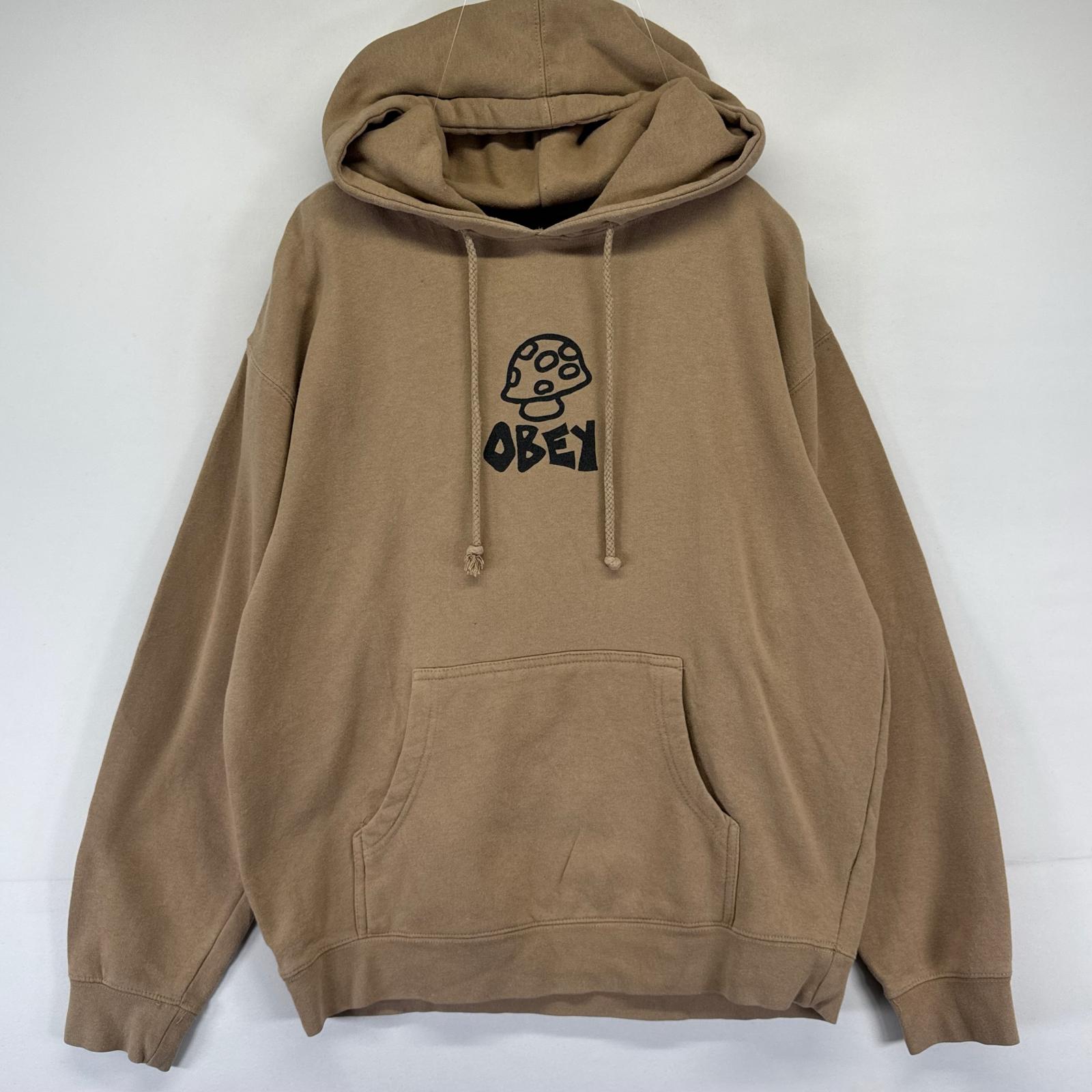 Rakuten - 古着 オベイ OBEY パーカー プルオーバー スウェット プリントロゴ バックプリント キノコ M ベージュ系 メンズ 【中古】