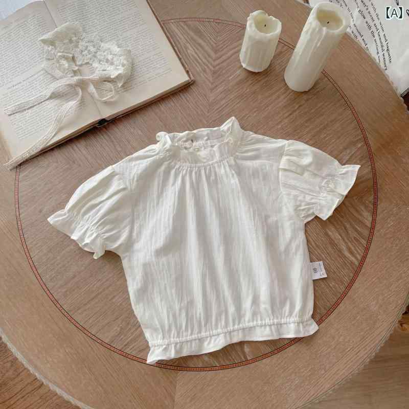 Rakuten - 女の子 ベビー トップス 立領 短袖 綿 かわいい デザイン 柔らかい 素材 純色 米 夏 シーズン 1-3歳 80-100cm 対応 韓風 スタイル 潮 ファッション 要素 シンプル 日常使い 赤ちゃん 女児 シャツ ブラウス 軽やか 肌触り 良い 無