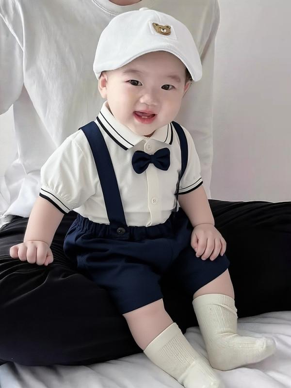 ・カテゴリ: 子供服セット・性別: メンズ・スタイル: 英国風・セット内容: トップス、パンツ（2点セット）・対象年齢: ベビー・キッズ（1～3歳、身長80～100cm）・袖丈: 半袖・フード: フードなし・パンツ丈: ショートパンツ・生地の厚さ: 薄手・柄: 無地・デザイン要素: サスペンダー・主な素材: 綿95%・安全基準: A類・留め具の種類: シングルブレスト・カラー展開: ホワイトブルー紳士サスペンダー、レッドブルーフォーマルサスペンダー、ホワイトブルーフォーマルサスペンダー、ブルーアプリコットフォーマルサスペンダー・サイズ展開: 73cm、80cm、90cm、100cm、110cm、120cm