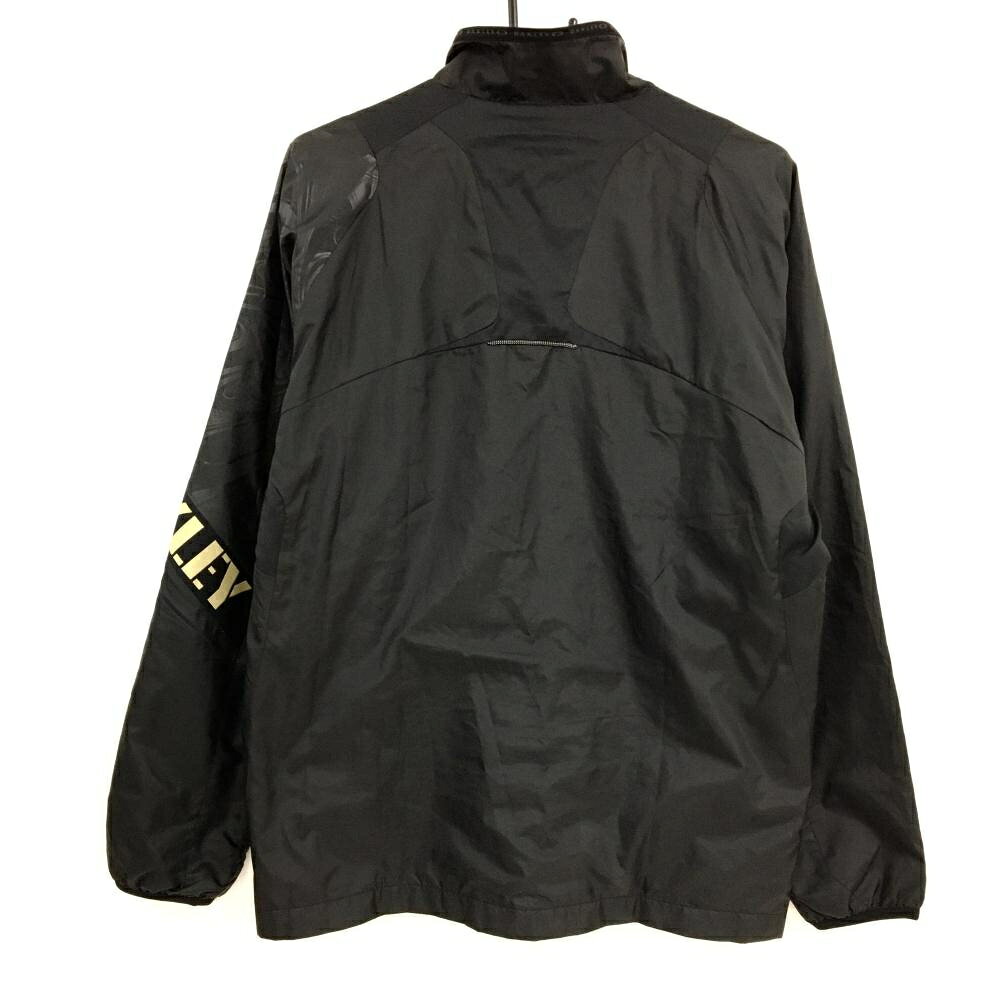 【美品】オークリー ジャケット 黒 一部総柄地模様 ロゴゴールド 裏地付 メンズ L ...