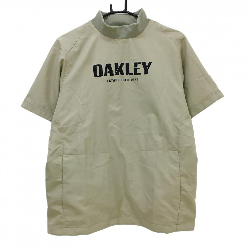OAKLEY - 【当店ポイント10倍！楽天スーパーセール期間限定】【超美品】オークリー 半袖ハイネックブルゾン ベージュ ロゴ黒 撥水 防風性 ストレッチ メンズ M ゴルフウェア 2024年モデル Oakley