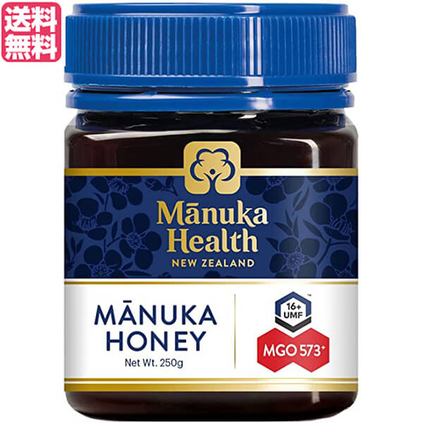 マヌカヘルス マヌカハニー MGO573/UMF16は、ニュージーランド固有のマヌカの花から採集された、濃厚な色合いとクリーミーな甘さが特徴のマヌカハニーです。 商品名のMGO数値は食物メチルグリオキサールの含有量(mg/1kg当たり)を示しています。 ◆What is Manuka Honey? マヌカハニーとは、驚くべき力が高く評価されている、貴重で特別なニュージーランド産はちみつです。 ニュージーランド原生のマヌカ（フトモモ科）の花蜜から採れるマヌカハニーには、他のはちみつにはほとんど含まれていない、独自の天然成分が含まれています。 その驚くべき自然の力が広く研究され、認められた最初のはちみつです。 ・The Magical Manuka Tree 原生のマヌカの木は、ニュージーランドの厳しい自然環境の中で繁栄するために、他に類を見ないほど順応します。強さに富むマヌカは、土地の自然保護と再生能力の役割を果たします。 マヌカは古くからニュージーランドのマオリ族によって重んじられ、伝統的に使用されていました。マヌカの花蜜からもたらされる特別な自然の力は、他のはちみつにはないマヌカハニーならではの特徴です。 マヌカの花の成長段階を見極めることで、プレミアムなマヌカハニーが作られます。 ・Why is Manuka Honey so special? ニュージーランド国内のみで、1年のうちマヌカが開花するわずか数週間しか採蜜できないため、マヌカハニーは貴重です。 春から夏にかけて気温が上昇すると、ニュージーランドの遥か北でマヌカが開花し始め、暖かい気候が全土に広がるにつれて続々と開花します。花芽の最初の兆候から、花蜜を生産し終えるまで約25日。その限られた時間の中で、養蜂家は巣箱を配置し、ミツバチは花蜜を集めなければなりません。養蜂家はシーズン中24時間休みなく働き、ヘリコプターで巣箱を遠隔地に移動させることもあります。 ミツバチにとって、マヌカハニーを作るための最適な気象条件が必要です−雨で巣箱の外に出られない間に、強風によってマヌカの花が散ってしまうこともあります。巣箱でのはちみつの生産量と、その年のはちみつの総生産量は、気象条件とマヌカの花蜜の生産量に大きく左右されます。 マヌカハニーが希少であり高価である主な要因は、限られた自然条件のみならず、養蜂家の優れた計画と迅速な行動が求められるためなのです。 ＜マヌカへルス＞ 当社は、ニュージーランド産のBee product（ミツバチ由来の製品）の健康パワーに着目し、それらを科学的に解明し活用することによって世界の人々と共有したいという想いから、2006年に設立されました。 今では、約15億匹のミツバチと140人の熱心な専門家のチームにより、ニュージーランドの自然が育んだマヌカハニー、プロポリス、ローヤルゼリー、ニュージーランドグルメハニーを丁寧に製造しています。 マヌカハニーとプロポリスの科学研究の先駆けである当社は、長年をかけてBee productの秘密を解明し、その驚くべき自然の力を守り、活用してきました。長年の研究で培った深い知識と確かな品質こそが私たちの強みです。 ニュージーランド国内の自社工場で巣箱から製品梱包までを一貫管理し、厳しいテストによって純度とグレードが保証された確かなBee productをお届けいたします。 ■商品名：マヌカハニー UMF MGO マヌカヘルス マヌカハニー MGO573/UMF16 ニュージーランド はちみつ 蜂蜜 ギフト プレゼント 高級 送料無料 ■内容量：250g ■原材料名：ニュージーランド産はちみつ ■メーカー或いは販売者：富永貿易 ■賞味期限：製造日より48ヶ月 ■保存方法：高温多湿を避け、冷暗所に保存 ■区分：食品 ■製造国：ニュージーランド【免責事項】 ※記載の賞味期限は製造日からの日数です。実際の期日についてはお問い合わせください。 ※自社サイトと在庫を共有しているためタイミングによっては欠品、お取り寄せ、キャンセルとなる場合がございます。 ※商品リニューアル等により、パッケージや商品内容がお届け商品と一部異なる場合がございます。 ※メール便はポスト投函です。代引きはご利用できません。厚み制限（3cm以下）があるため簡易包装となります。 外装ダメージについては免責とさせていただきます。