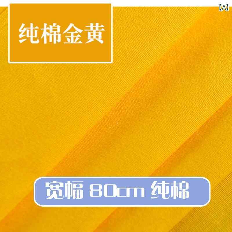布 生地 シワになりにくい 金色布地の中に赤と黄色の布地が敷かれた贈答箱、シルクやサテン生地で装飾されたテーブルクロスやクッション、カーテン、ソファ