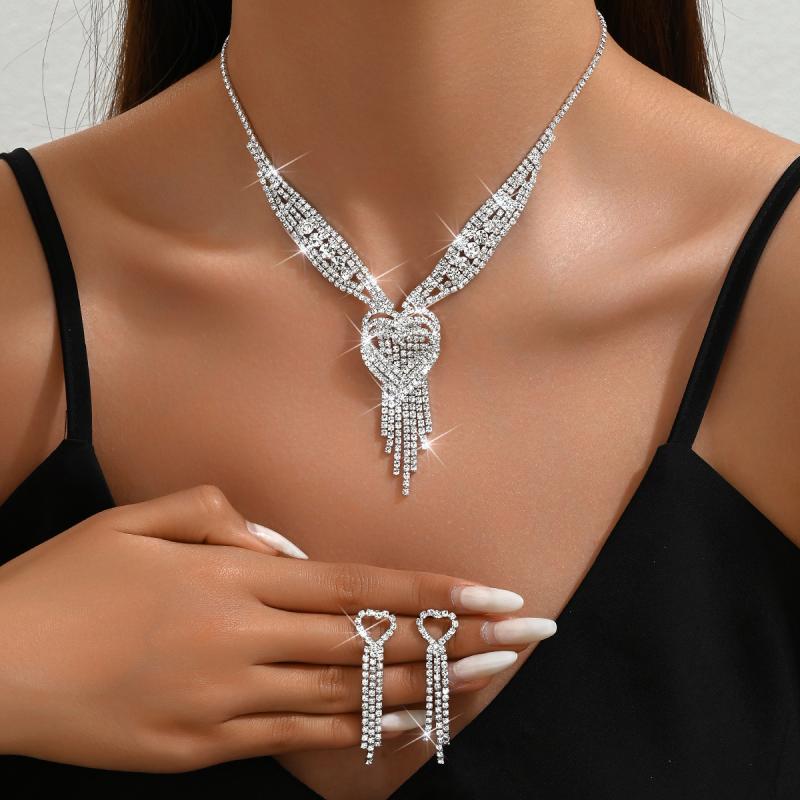 Wedding Jewelry Set: Flash Full Rhinestone Three-Layer Heart Tassel Necklace, Earrings, and Studs. Sparkling and glittering wedding accessory set for women. Elegant and romantic style.