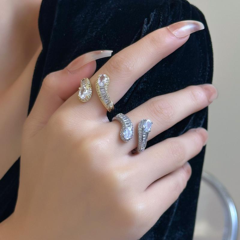 指輪 女性用 夏 オープンデザイン 蛇モチーフ 輝く石 かわいい 個性的 トレンド 軽...