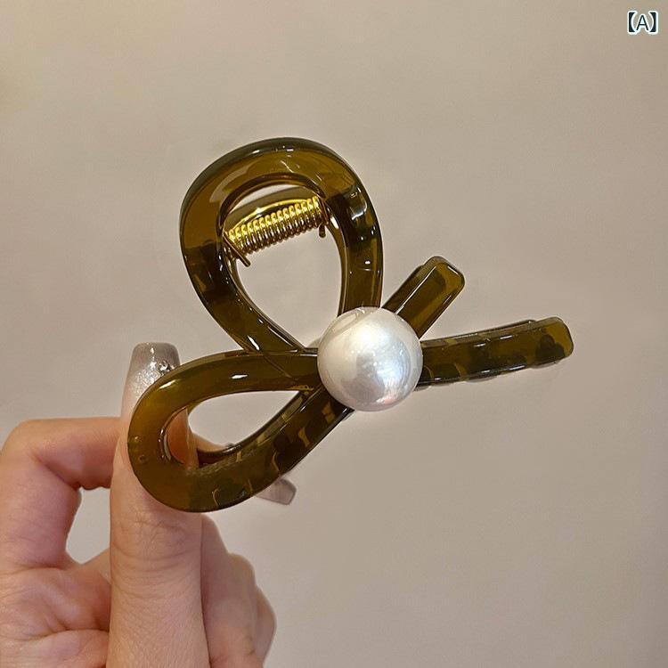 リバーパディのヘアアクセサリー 女性用 かわいい 珍珠 クロスデザイン サイドヘアピン 後頭部用 鮫魚クリップ 高級感 軽量 普段使い 春夏 ブラック ピンク系｜アングル2