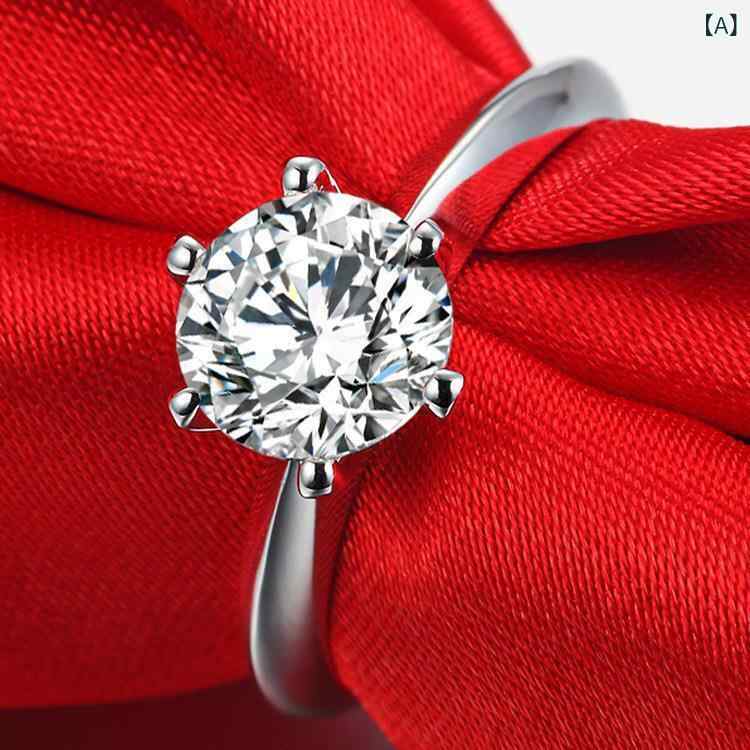 リバーパディの指輪 女性用 1カラット 八心八箭 高炭素ジルコニア シンプル 六爪 婚約指輪 結婚指輪 輝き クリア カット 日常使い フォーマル シルバー ゴールド ピンクゴールド ホワイトゴールド ラウンドシェイプ 耐久性｜アングル2