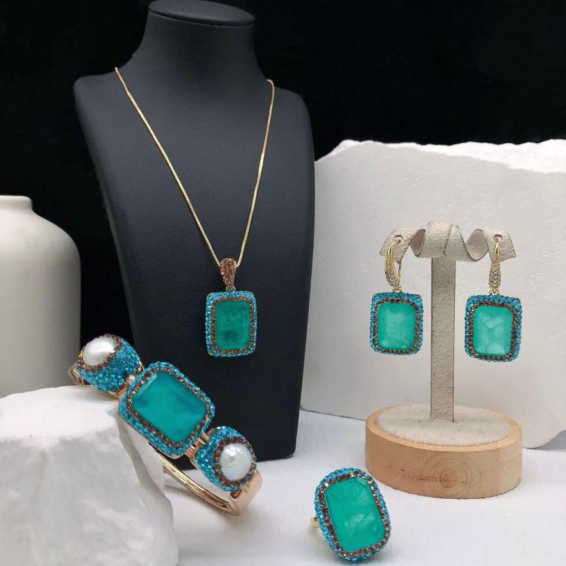 Women's Jewelry Set: Ocean Blue Paraiba Stone and Freshwater Pearl Bracelet, Necklace, Ring, and Earrings. A versatile and elegant set perfect for everyday wear. Features a delicate design, sparkle, and simple elegance. An ideal gift.