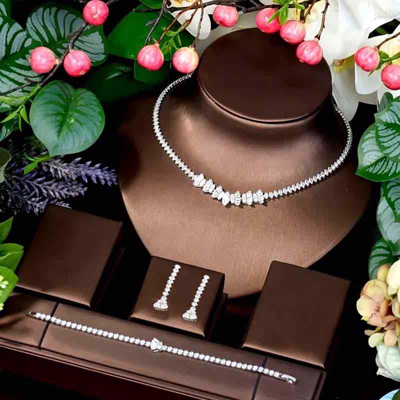 Ladies' Jewelry Set: Simple and Modern Zirconia Ring, Wristband, and Necklace Set. Unique and Inspirational. Lace-cut design. Perfect for weddings, everyday wear, and gifts. Lightweight and delicate. Available in silver and gold colors.