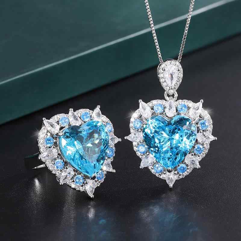 Women's Jewelry Set with Ocean Motif: Necklace, Pendant, and Ring Set. Features ocean blue artificial gemstones, gold-plated copper base, heart-shaped round 15mm pendant, sparkling and elegant. Perfect for everyday wear and gifting.