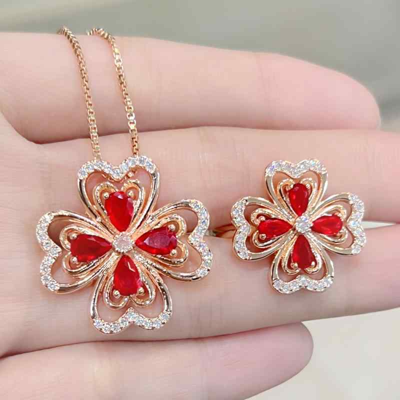 Women's Jewelry Set: Heart and Leaf Design, Red Zirconia and Ruby Pendant Necklace and Ring Set. A fashionable, colorful, sparkling, and elegant accessory perfect for everyday wear. A great gift idea. Red-toned accessories.