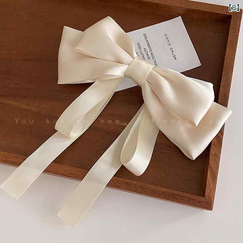 リバーパディのヘアクリップ 女性用 かわいい リボン 蝶結び 接触冷感 夏 春夏 軽量 優雅 気品 後頭部 ヘアアクセサリー ピンク系 アイボリー ブラック 通勤 普段使い 髪飾り｜アングル3