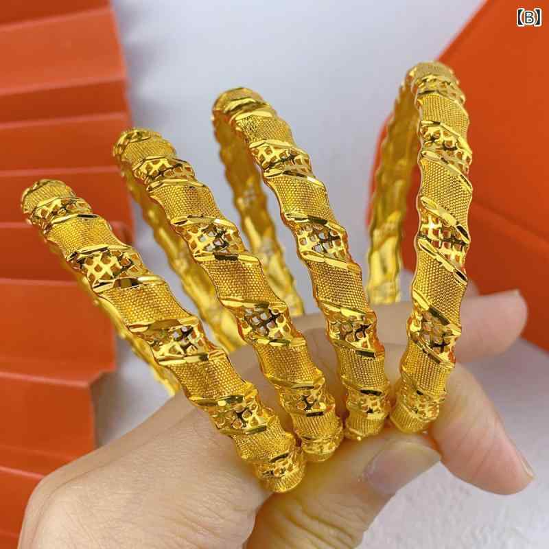リバーパディのレディース 手首アクセサリー 女性用 ゴールド ブレスレット バングル 24K 電気メッキ加工 空洞 彫刻 花柄 トーテム 結婚式用 シンプル 華やか ゴールドカラー 軽量 普段使い かわいい 女性向け ジュエリー アクセサリー 手元 装飾｜アングル3