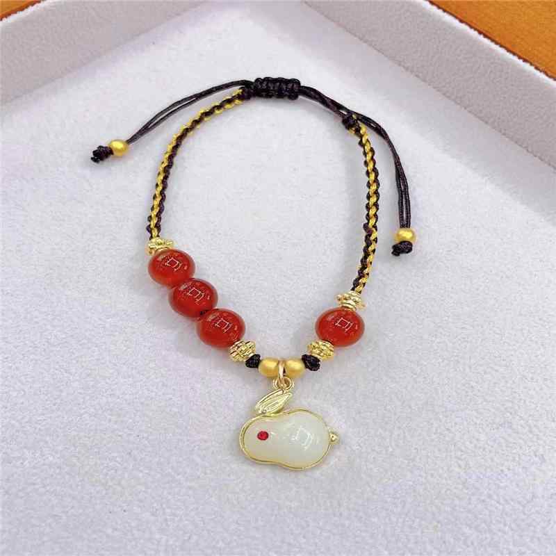 Hand-knitted wrist accessory for women, cute red crystal rabbit motif, perfect for spring and summer, lightweight, everyday wear, fashion bracelet, hand ornament.