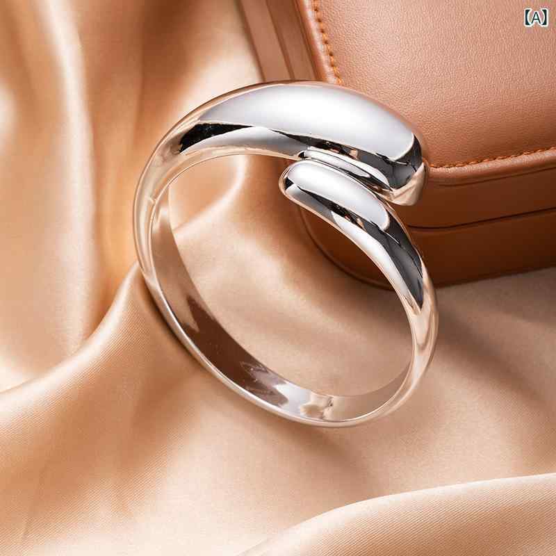 ブレスレット メンズ ウーマンズ 幾何学 楕円形 オープン 手首 アクセサリー シンプル ミニマル ファッション トレンド モダン デザイン 高級感 スタイリッシュ 日常使い 軽量 金属 シルバー ゴールド 調節可能 人気 手元 華やか 洗練 アクセント 2