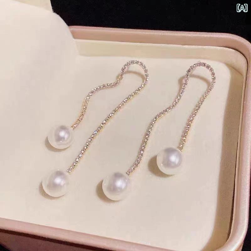 イヤリング 女性用 長さ長め タッセル 装飾 クリスタル チェーン 軽量 ファッション 冷淡 トレンド アクセサリー シルバー加工 揺れデザイン 華やか 日常使い 通勤スタイル カジュアル 洗練 ビッグシルエット