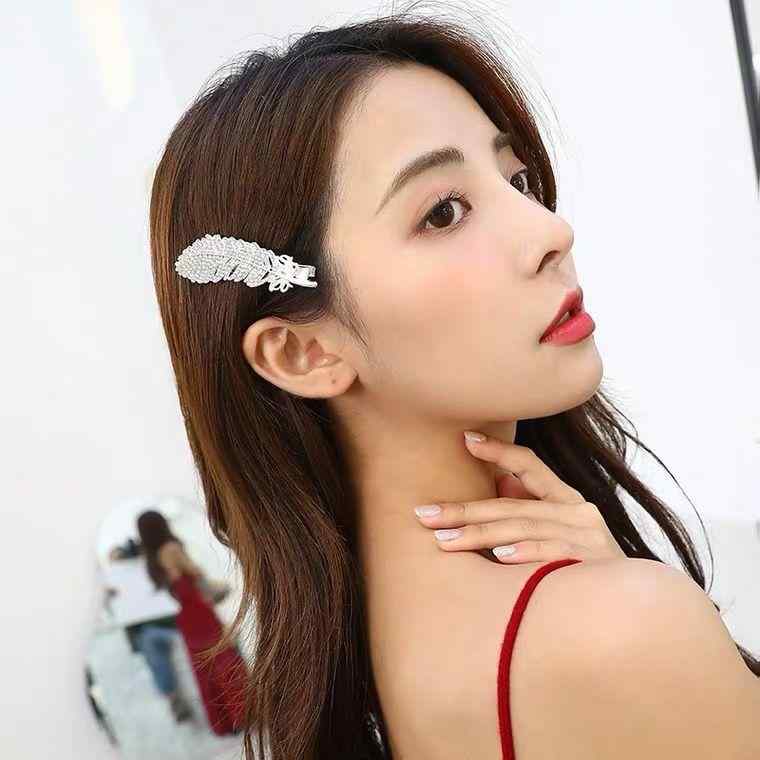 ヘアクリップ レディース ヘアアクセサリー フェザー 羽モチーフ ジルコニア スト...