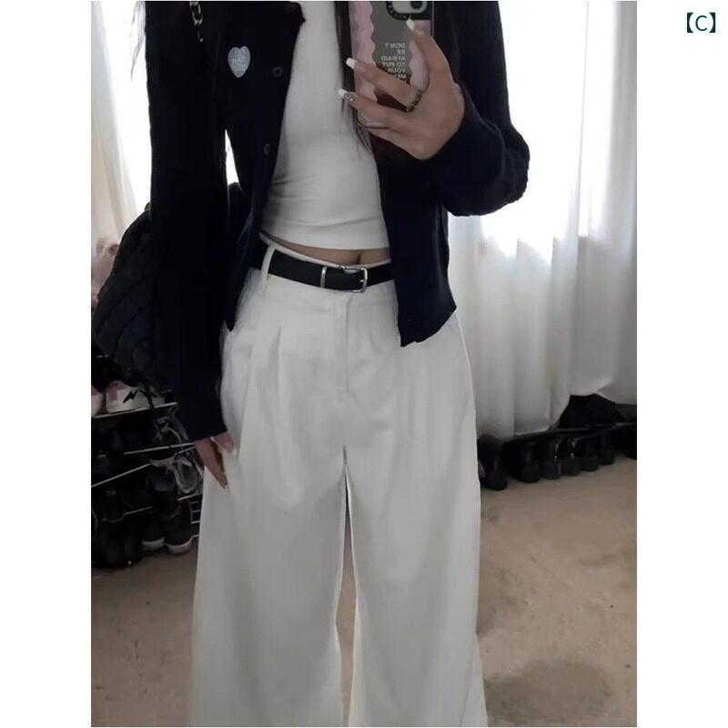 180cmの背の高さ女性用に白色のワイドレッグジーンズ。折り目が付いておりゆったり...