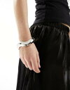GC\X ASOS DESIGN bangle bracelet with wave detail in silver tone fB[X