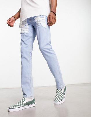 エイソス エイソス ASOS DESIGN skinny jeans with heavy rips in light wash blue メンズ