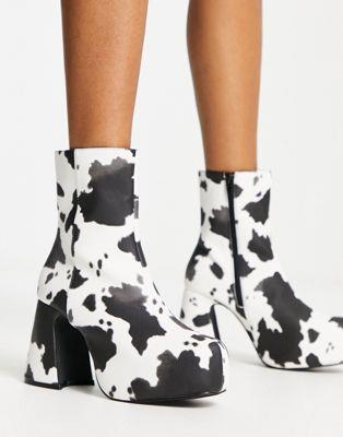 楽天サンガHeartbreak platform heeled ankle boots in cow print レディース