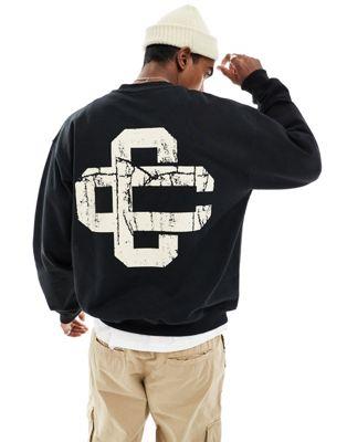 The Couture Club cracked print emblem sweatshirt in black メンズ