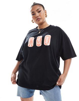 ASOS Curve エイソス ASOS DESIGN Curve oversized heavyweight t-shirt with coca cola cans licence graphic in black レディース