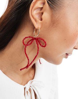 エイソス エイソス ASOS DESIGN hoop earrings beaded bow charms in red tone レディース