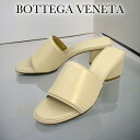 ボッテガヴェネタ THE BAND レザー サンダル ヒール高 5.5cm レディース 651378 VBSL0 9031 BOTTEGA VENETA ボッテガ シューズ 靴 【新品】 【正規品】 【送料無料】 【プレゼント】 【ギフト】 【ギフトラッピング無料】 【営業日12:00までのご注文で最短当日発送】BOTTEGA VENETA（ボッテガ・ヴェネタ）THE BAND レザー サンダル ヒール高 5.5cm アッパー：レザーヒール：5.5cm付属品：保存袋・ブランド箱こちらの商品はブランド直営アウトレット店から買い付けた正規品です。※ 国内直営店でメンテナンス可能です。当店ではギフトラッピングを無料でご提供し、メッセージカードやオリジナルペーパーバッグもオプションでご利用いただけます。ご購入の際には、これらのサービスをご活用いただき、贈り物にさらなる特別感を加えてみてはいかがでしょうか。誕生日には、記憶に残る特別なプレゼントを。クリスマスには、温かな気持ちを伝えるアイテムを。結婚記念日やバレンタイン、ホワイトデーには、お二人の大切な瞬間を彩る逸品を。また、母の日や父の日、成人の日、卒業・入学祝いなど、家族の節目には心を込めたギフトで感謝の気持ちを。などあらゆる記念日やイベントに当店の商品とサービスで、大切な方への感謝と思いやりを伝えるお手伝いをさせていただきます。◆アウトレット商品について◆ブランド直営のアウトレット店舗では、主にシーズンの古い商品が販売されております。中には目立たない程度のスレやくぼみ等が見られることがありますが、全てが傷物や訳あり商品というわけではございません。1つ1つ丁寧に検品しておりますのでご安心してご利用ください。商品は店頭販売の基準をクリアしておりますが、アウトレット特性をご理解賜りますようお願い申し上げます。何かご不明点やご心配な点がございましたら、お問い合わせいただけますと幸いです。◆ギフト対応について◆ギフトラッピングをご希望の方は、セレクトボックスより【ギフトラッピング希望】を選択してください。また、有料でメッセージカードやオリジナルペーパーバッグもご用意しております。購入をご希望される場合、画像をクリックし商品ページにアクセスした後、買い物カゴに追加してご希望の商品と一緒にご注文ください。◆在庫について◆当店の商品は複数店舗で販売されており、在庫の更新にタイムラグが生じることがあります。その為、ご注文後でも商品が欠品となる場合があります。万が一ご注文後に商品の欠品が発生した場合、キャンセルさせていただくことがありますので予めご了承ください。◆箱のダメージについて◆海外からの輸送によりシューズボックスなどの角にダメージが入ってしまうことがあります。アウトレット商品は、販売時点で箱の状態が良くないことが多いです。そのため、お求めやすい価格でご提供できる点もございますので何卒ご理解いただきたく存じます。また、箱のダメージについては、ショップ保証の対象外となりますので、何卒ご理解いただけますよう願い申し上げます。 5