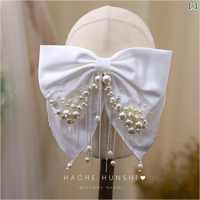 セキュアデポのリボン ヘアクリップ レディース ブライダル ウェディング 華やか フレンチ サテン ホワイト パール タッセル 頭飾り 写真 アクセサリー シンプル エレガント｜アングル2