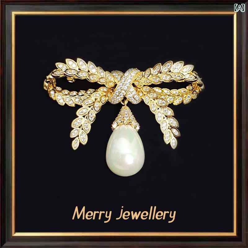 ブローチ リボン ゴールド 黄金 キラキラ 蝶々結び 上着 ベスト コート トップス 飾り パール レディース 豪華感 エレガント コサージュ