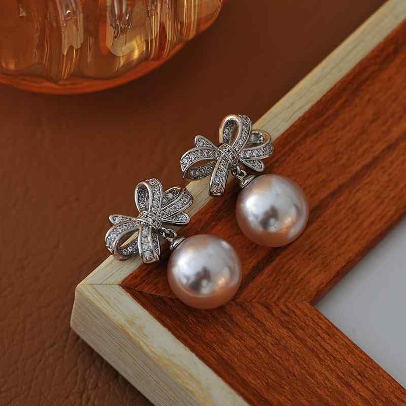 ピアス レディース パール パール リボン 蝶結び 高級感 エレガント 繊細 洗練 上品 個性的 ユニーク 銅合金 電気メッキ加工 日韓スタイル かわいい 普段使い フォーマル 耳飾り