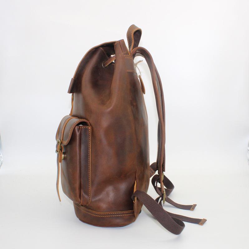 ・カラー: ブラック、ダークブラウン・サイズ: 約35x15x45cm・性別: ユニセックス・シーン: デイリーユース・素材: 本革・スタイル: 欧米ヴィンテージ・革の種類: 牛革・容量: 20L以下・機能: 耐摩耗性・PC収納サイズ: 〜35.56cm (14インチ相当)・柄: 無地・裏地素材: ポリエステル綿・デザイン要素: ステッチ・ショルダーハーネス: 曲線型・タイプ: バックパック、スクールバッグ、モーターサイクルバッグ