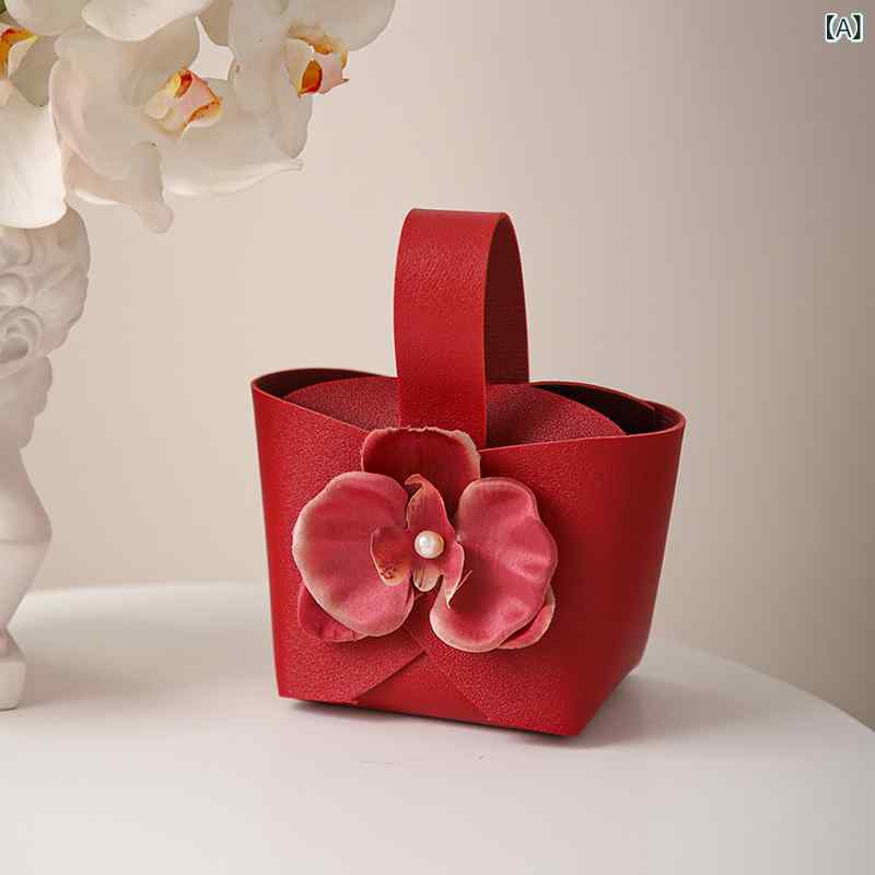 ・形状: 袋型・サイズ: 9×6×16cm・カラー展開: 赤+蝶蘭、シャンパンミ色+蝶蘭、玫紅+蝶蘭、紫+蝶蘭、青+蝶蘭・素材: 合成皮革・スタイル: 欧風、軽奢・適用シーン: 結婚式