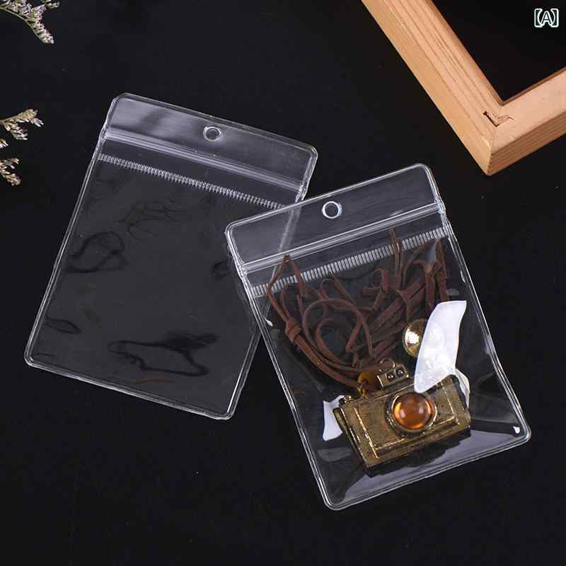 ジュエリー収納バッグ 吊り下げ用の 穴が 開けられた PVC 透明 ジュエリー 密封 バッグ、 ジップロック..