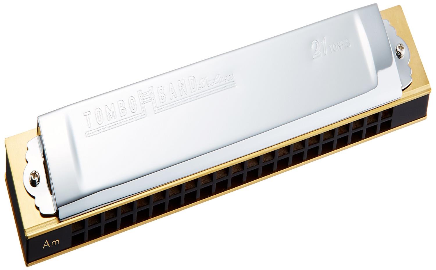 スタイル：1521Am◆商品名：TOMBO トンボ 複音ハーモニカ Am調 特製トンボバンド 21穴 1521木製本体が生み出す上質であたたかな音色と、緩やかなトレモロは童謡、唱歌、演歌、なつメロをはじめ、タンゴ、シャンソンなど世界各国の名曲にも最適です。初心者の方からプロフェッショナルまで、演奏会用として幅広く愛用されています。材質:木製(本体)、真鍮材クロムメッキ(カバー)寸法:166(W)×29.5(H)×22(D)mm 重量:131gキー:Amハードケース付属商品紹介 日本を代表し、世界に誇る複音ハーモニカの決定版です。美しいトレモロの音色は、世界の名曲、同様、なつメロ、塩化、流行歌、シャンソン、タンゴ等、万能に演奏できます。 複音ハーモニカは上下2段に僅かにピッチを変えた同じ音が入っています。 2つの穴を同時に吹くことによりトレモロのついた情緒豊かな美しい音色が得られます。 ★直接口をつける商品です。衛生上の観点から、商品不良以外の理由での返品はお断りいたします。 ★掲載の商品は店頭や他のECサイトでも並行して販売しております。在庫情報の更新には最大限の努力をしておりますが、ご注文が完了しましても売り切れでご用意できない場合がございます。その際はご注文をキャンセルさせていただきますので、予めご了承くださいませ。