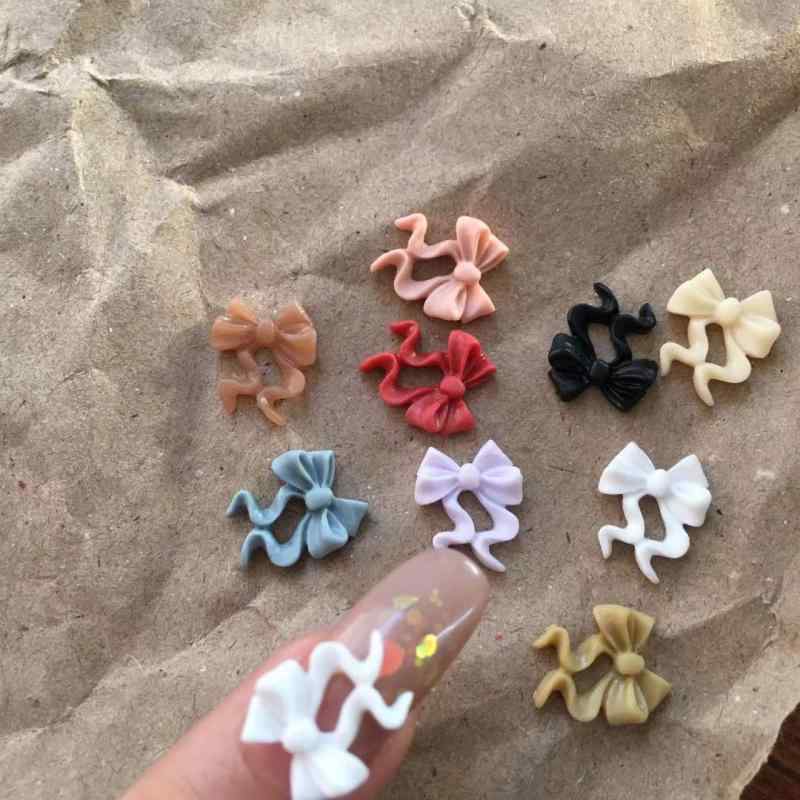 ネイルパーツ 韓国風 樹脂 立体 磨りガラス調 蝶々 リボン デコレーションパーツ ウェーブ 100個 カラ..