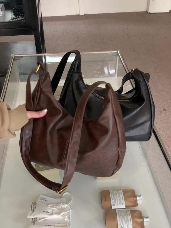 ・カラー: ブラック、コーヒー・スタイル: 都市シンプル・素材: PU・バッグサイズ: 大・適用シーン: 日常・流行要素: ステッチ・裏地: ポリエステル・バッグ形状: 縦型・開閉方法: ファスナー・バッグ内部構造: ファスナー付きポケット、携帯電話ポケット・外ポケット: オープンポケット・硬さ: ソフト・仕切り: なし・ストラップ数: シングル