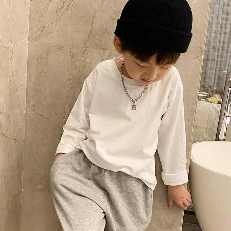 Rakuten - 子供服 長袖 Tシャツ トップス インナー 中小童 男の子 女の子 ユニセックス 秋冬 春秋 綿100% 柔軟 吸湿排汗 丸首 無地 純色 黒 白 軽量 伸縮性 通年 通勤 普段使い 部屋着 3〜8歳 100〜140cm