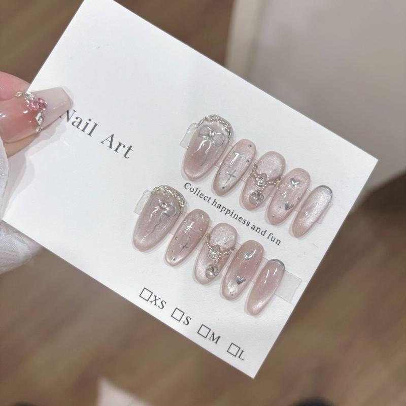 ネイルチップ 女性用 かわいい 猫眼 甘め クール キラキラ 透明感 シンプル インスピレーション ロング 中長 楕円形 透明 装着式 ハート 蝶結び 浮き彫り 手作り ピンク系 アイボリー 伸縮性 軽量 通勤用 普段使い
