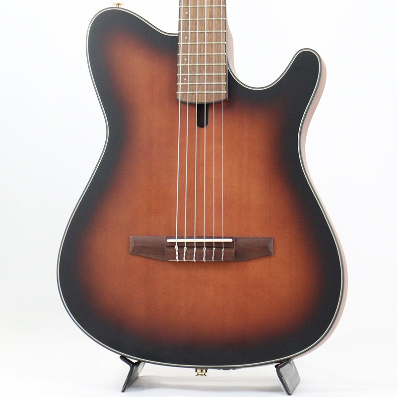 関連商品Ibanez/新品 商品一覧＞＞アコースティック・エレアコギター【45，000円〜95，000円】 商品一覧＞＞エレアコギター/Ibanez 商品一覧＞＞Ibanez FRH10N-BSF エレアコギター (アコースティック・エレアコギター)商品説明FRH10 Nylon Electric Guitarエレクトリック・ギター・プレイヤーの為の 、ナイロン・サウンド・ギター。カジュアルなアプローチでナイロン・サウンドを取り入れたい。いつものエレキとそれほど違和感がなく弾けるナイロン・ギターが欲しい。そして、ステージだけでなくリビングルーム・ギターとしても楽しい楽器が、良い。Ibanez FRH10Nはそれらをコンセプトに開発した、言わば ナイロン・エレクトリック・ギター です。アコースティックで爪弾けばプレイヤーを包むように鳴るそのナチュラルなナイロン・ストリング・サウンドが、そしてプラグインすれば新時代を感じられるディストーショナル・ナイロン・サウンドが、あなたの演奏体験に新たな1頁を加えてくれるでしょう。-サイド・ポート（側面孔）を装備したFRシェイプ・ホロウ・ボディ（w/ファン・ブレーシング）シングルカットのIbanezオリジナルFRシェイプを基に、クラシック・ギターでは一般的なファン・ブレーシングをトップ（表甲）に備えた厚さ約50mmのホロウ構造ボディです。ボディ表側にサウンド・ホールは有りませんが、プレイヤー側のボディ・サイドにサウンド・ポートを装備しています。エレキ・ギターと比べて大きく差のない構え心地で且つナチュラルなナイロン・サウンドを体感しやすい設計です。-46mm幅ナット/400mmR指板ナット幅は一般的なクラシック・ギターとエレキ・ギターの中間、指板には400 mmのRを付けています。エレクトリック・ギター・プレイヤーの演奏を想定し、スムーズなフィンガリングを実現するためにクラシック・ギターとは一線を画すスペックとしました。また、ナイロン・エレクトリック・ギターという新しいカテゴリを拓く本機は、バズ音すら厭わない一般的なクラシック・ギターと比べるとやや低めの弦高設定を選択しています。-Ibanez T-barアンダーサドル・ピックアップピックアップはノイズに強く、レンジの広いナチュラルなサウンドを出力するオリジナルのピエゾ・ピックアップです。-Ibanez Custom Electronics プリアンプエンドピン一体型のプリアンプです。ワンプッシュで消音可能なミュートスイッチを搭載しています。（CR2032x2で駆動）-シトカ・スプルース材単板ボディTOP、サペリ材ボディ SIDES & BACK-ウォルナット材指板＆ブリッジ-D'Addario XTC45弦（.028/.032/.040/.028W/.035W/.044W）※画像はサンプルです。商品詳細Body Shape: FRH bodyTop: Solid Sitka Spruce topBack & Sides: Sapele back & sidesBracing: Fan Bracing for FRHNeck: C Shape / Nyatoh set-in neckFretboard: Walnut fretboardBridge: Walnut bridgeInlay: White dot inlayTuning Machine: Gold Classical tunersNut Material: Bone nutSaddle Material: Bone saddlePickup: Ibanez T-bar undersaddle pickupPreamp: Ibanez Custom ElectronicsOutputjack: 1/4 OutputNeck DimensionsScale: 648mmWidth: 46mm at NUTWidth: 58mm at 14FThickness: 21mm at 1FThickness: 22mm at 7FRadius: 400mmRソフトケース付属◆Color:・BSF (Brown Sunburst Flat)イケベカテゴリ_アコースティック・エレアコギター_エレアコギター_Ibanez_新品 SW_Ibanez_新品 JAN:4549763335661 登録日:2023/02/17 エレアコ アイバニーズ イバニーズ