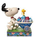 エネスコ Enesco 置物 インテリア 海外モデル アメリカ 【送料無料】Enesco Jim Shore Peanuts Snoopy and Woodstock Easter Wheelbarrow Figurine, 5.75 Inch, Multicolorエネスコ Enesco 置物 インテリア 海外モデル アメリカ