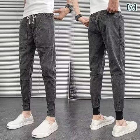 純 色の スリムな 足の デニムの ズボンの 男性の 韓国 版の ins 社会の 若者の ネットの 赤い 夏の レジャーの ハーレムの ズボンの 卸売り