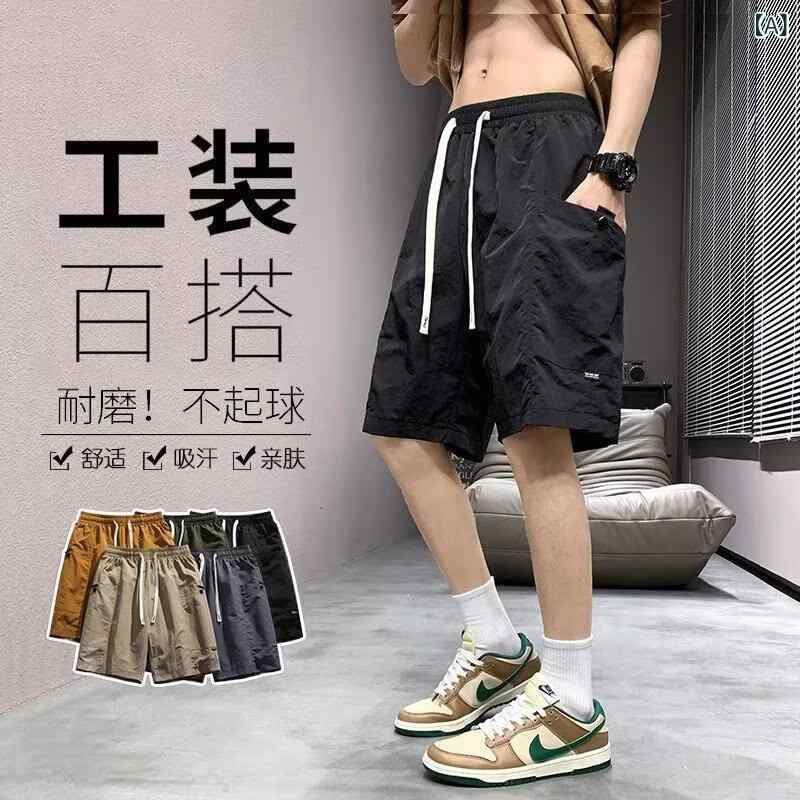 半 ズボンの 男性は 夏 2025 年の 新型の ファッション ブランドの ゆったり した 運動の カジュアルな ズボンの 薄い タイプの 5 分の 1の ズボンです。