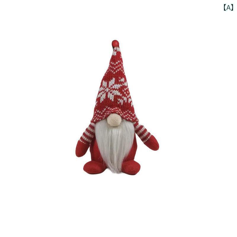 国境を 越えた クリスマス ニット 帽 人形の 座り 方に 顔の ない 人形の ショーウインドーが クリスマス 舞踏 会 パーティーの 装飾を 飾って いる